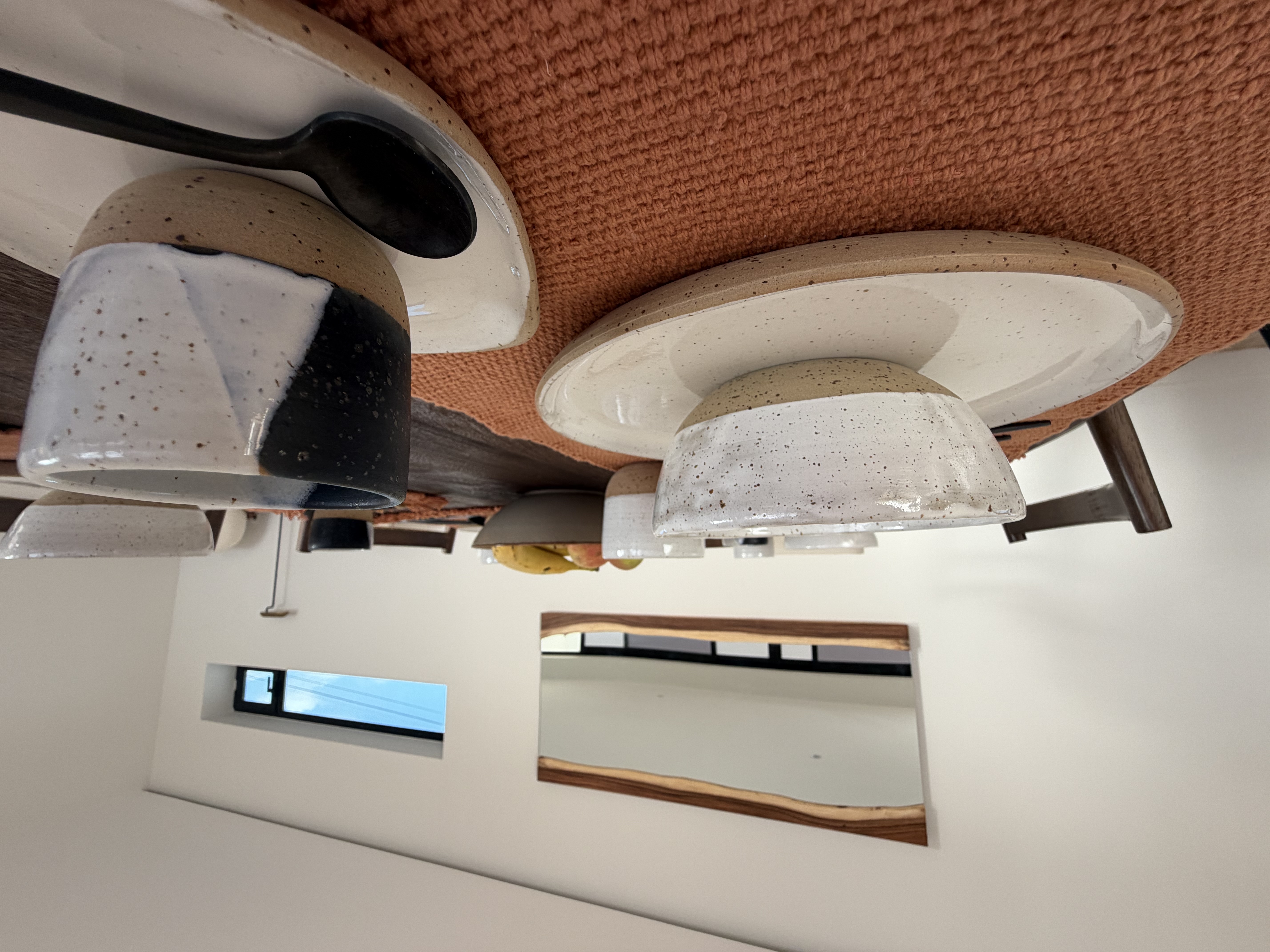 Dining table setup with candles and plates