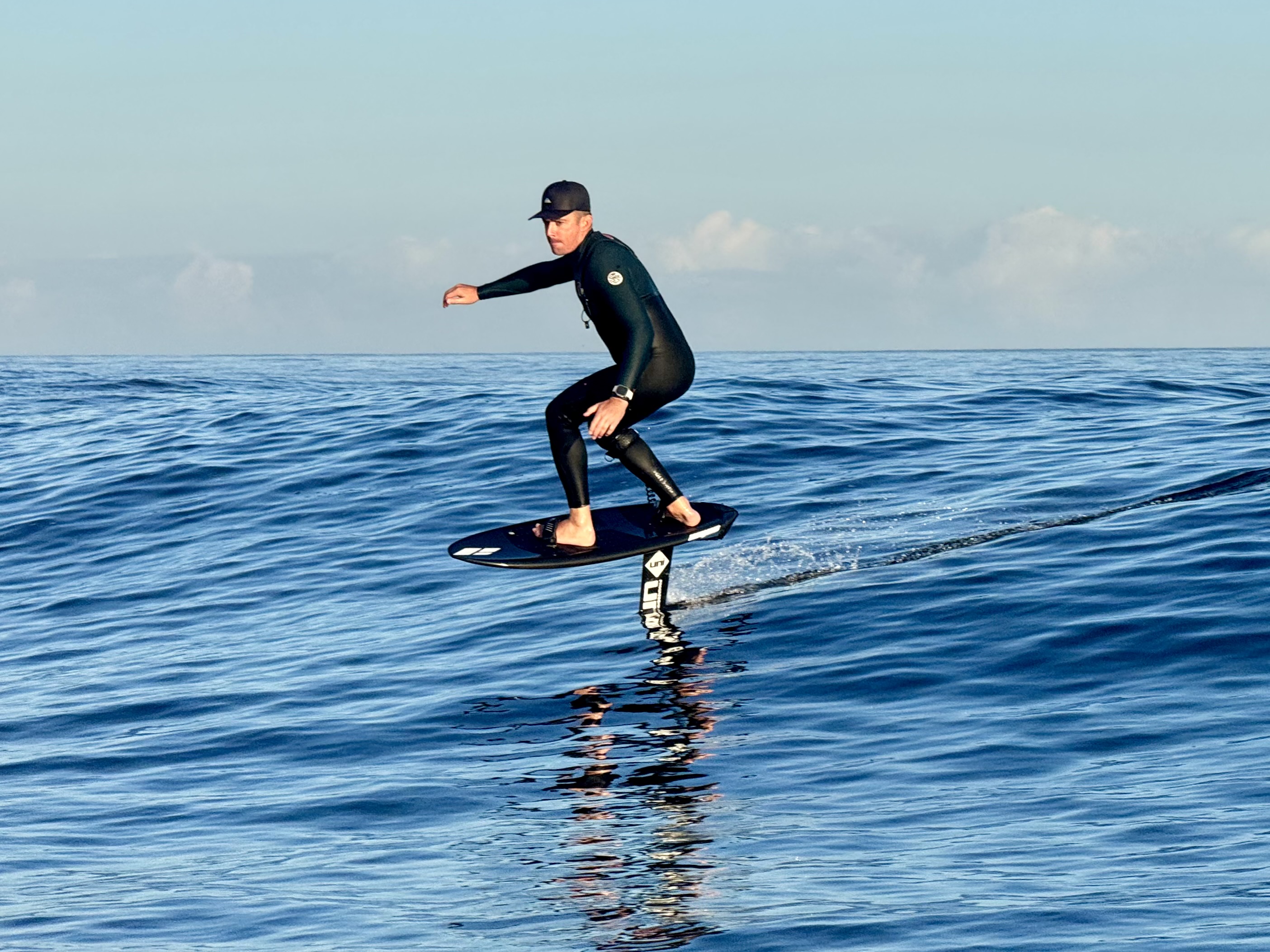 Foiler riding above the water near Fuerteventura