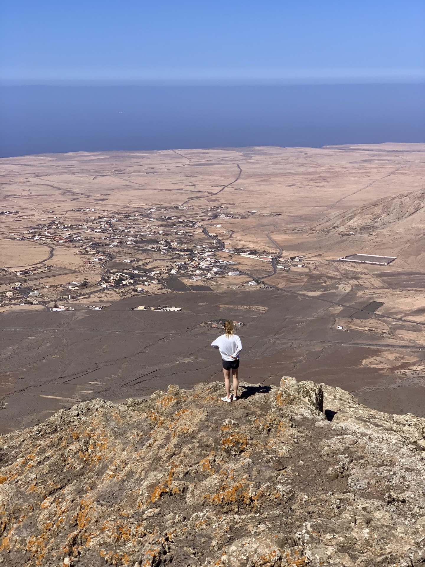 Hiker walking through volcanic desert near Lajares
