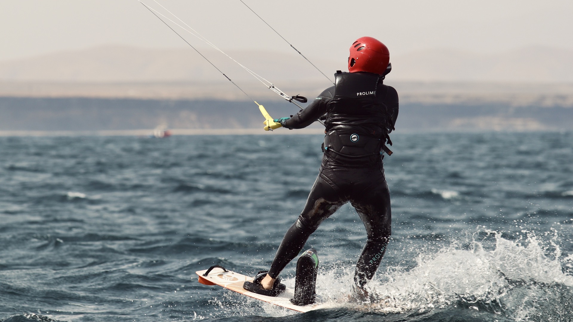 Kitesurfer on turquoise Fuerteventura waters