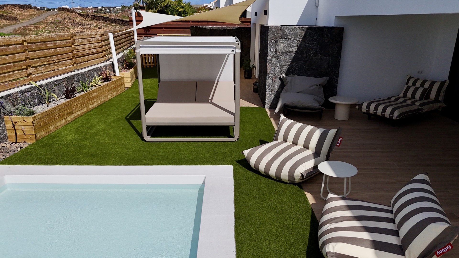 Aerial photograph of outdoor area with swimming pool and jacuzzi at Elements Lajares