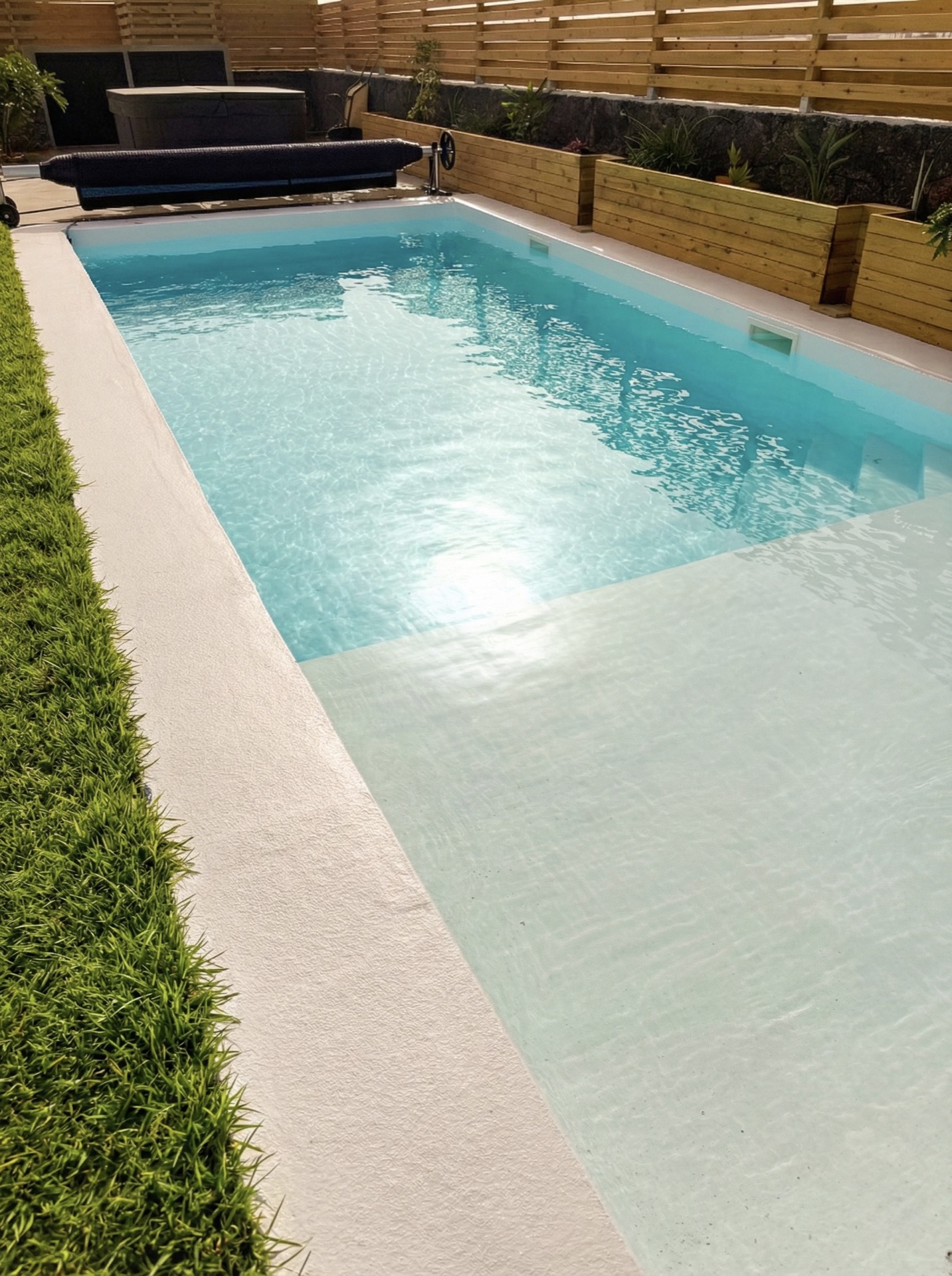 Outdoor pool and lounge area at Elements Lajares